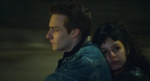 A man and a woman share an intimate moment in the dark in "Les Passagers de la nuit".