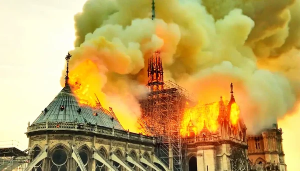 The iconic Notre-Dame Cathedral engulfed in flames as depicted in "Notre-Dame brûle".